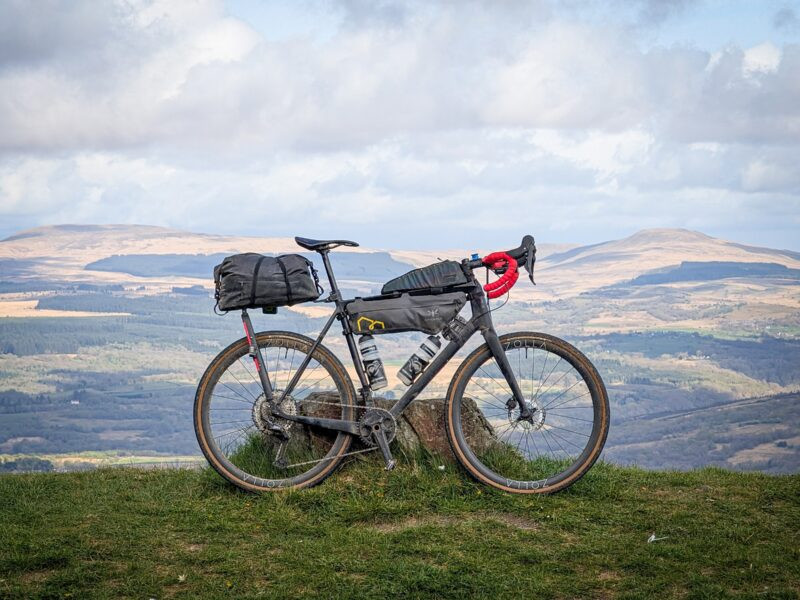 zolla-hilltop-bike-2025 Loaded gravel bike on Zolla wheels above a valley